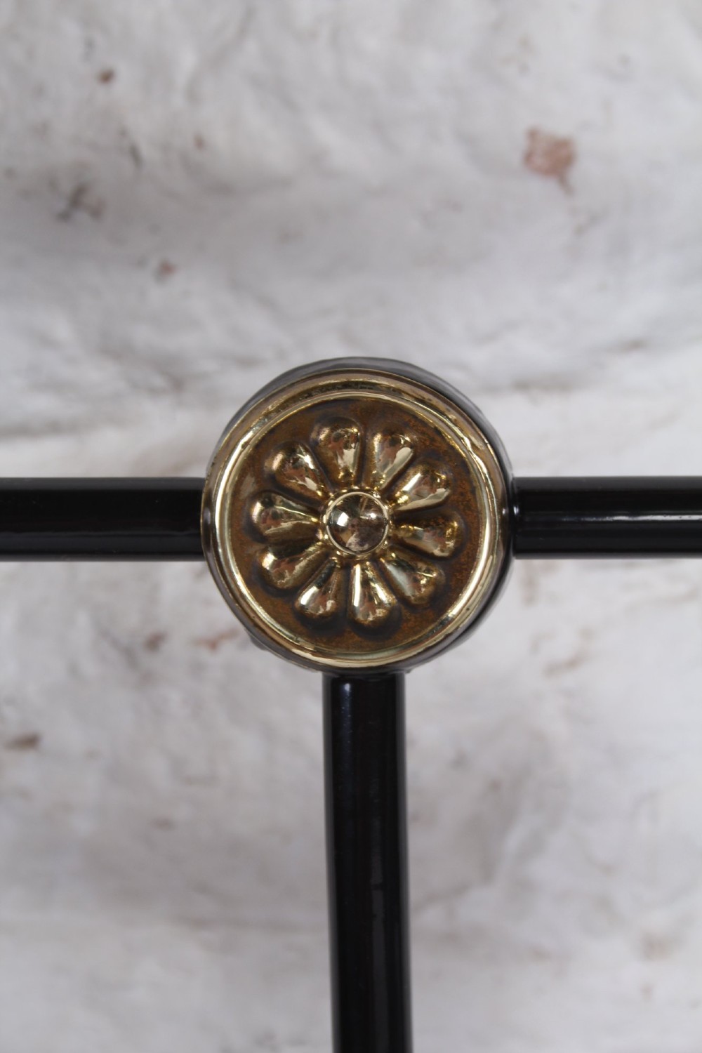 A Victorian black cast iron double bed frame with brass top rails, brass finials, and mother-of-pearl inlay details. View VI