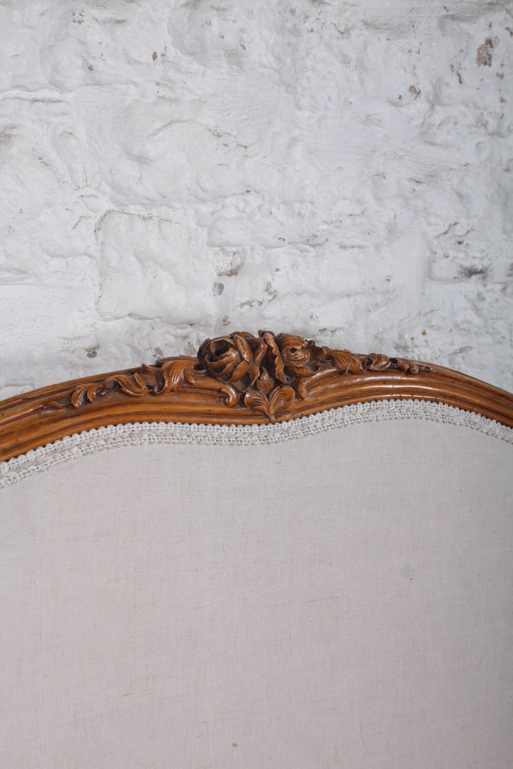A Louis XV style king-size bed frame featuring a carved wooden structure, cabriole feet, and neutral upholstered headboard and footboard panels. View IX