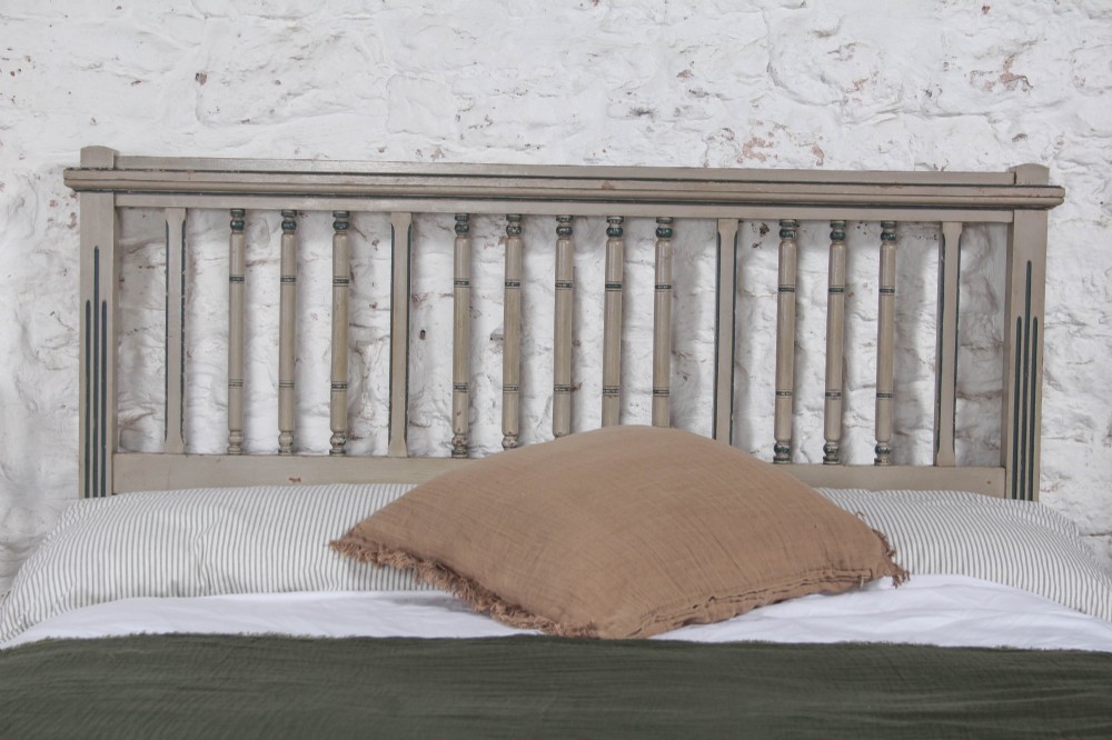 A grey painted French Arts and Crafts double bedstead featuring vertical spindle detailing and a patterned footboard. View IV