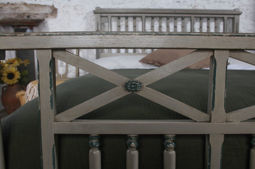 A grey painted French Arts and Crafts double bedstead featuring vertical spindle detailing and a patterned footboard. View VI