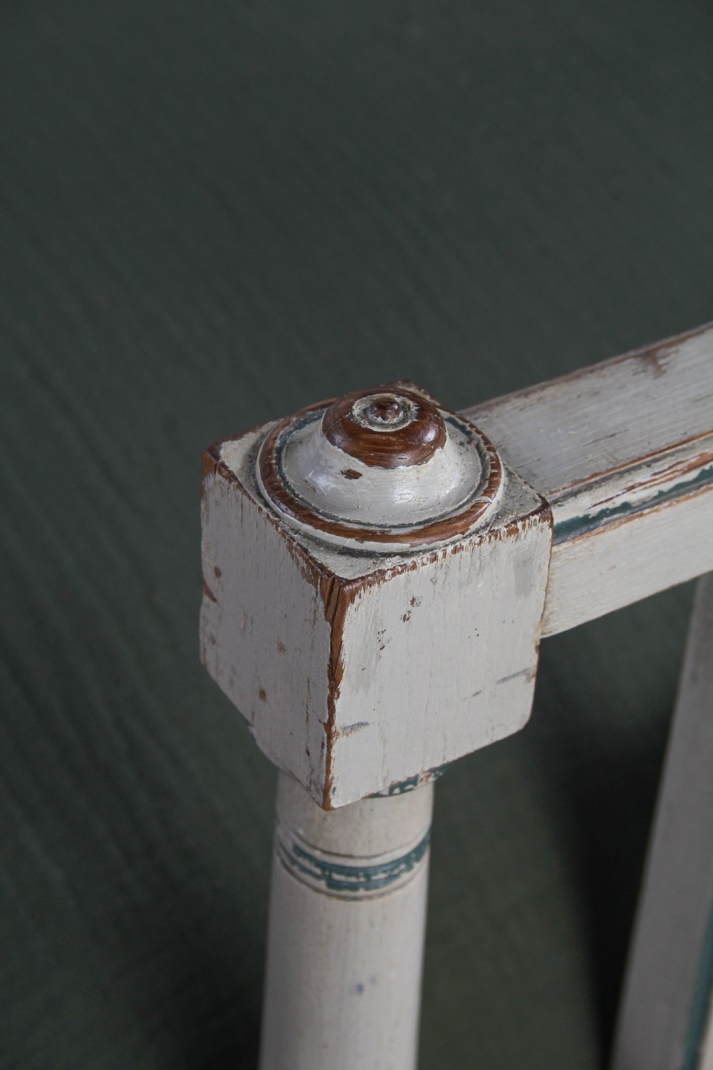 A grey painted French Arts and Crafts double bedstead featuring vertical spindle detailing and a patterned footboard. View VII
