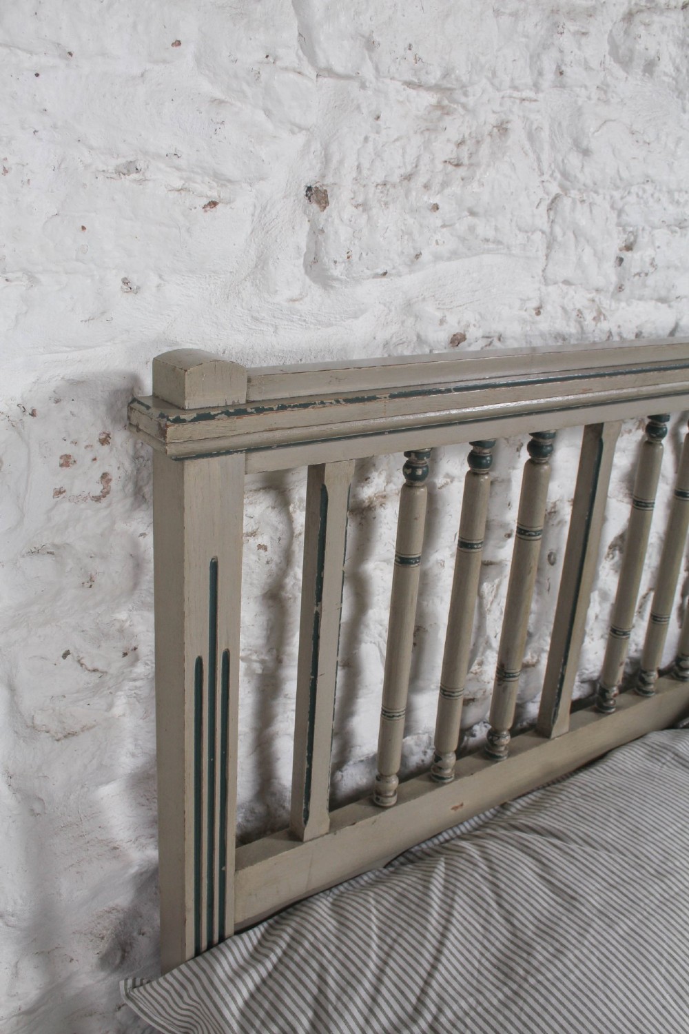 A grey painted French Arts and Crafts double bedstead featuring vertical spindle detailing and a patterned footboard. View VIII