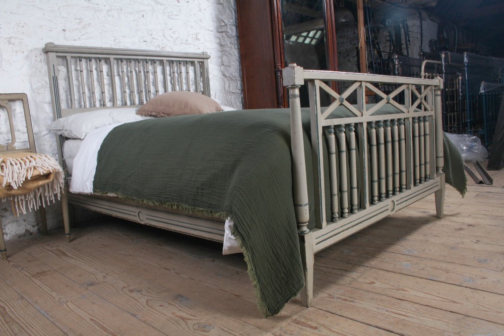 A grey painted French Arts and Crafts double bedstead featuring vertical spindle detailing and a patterned footboard. View IX