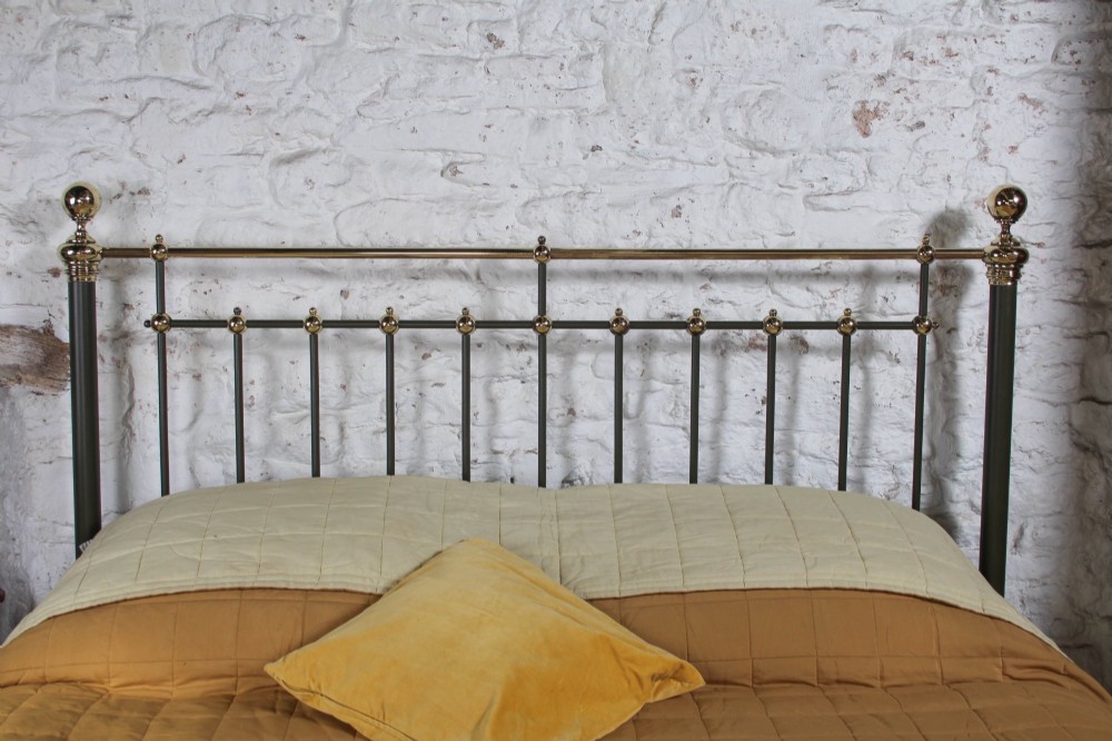 Victorian super-king size bedstead featuring dark green painted iron spindles and polished brass rails and finials. View III