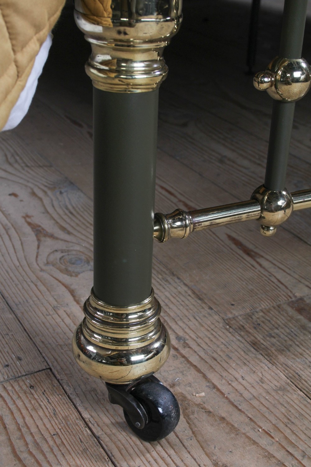 Victorian super-king size bedstead featuring dark green painted iron spindles and polished brass rails and finials. View VIII