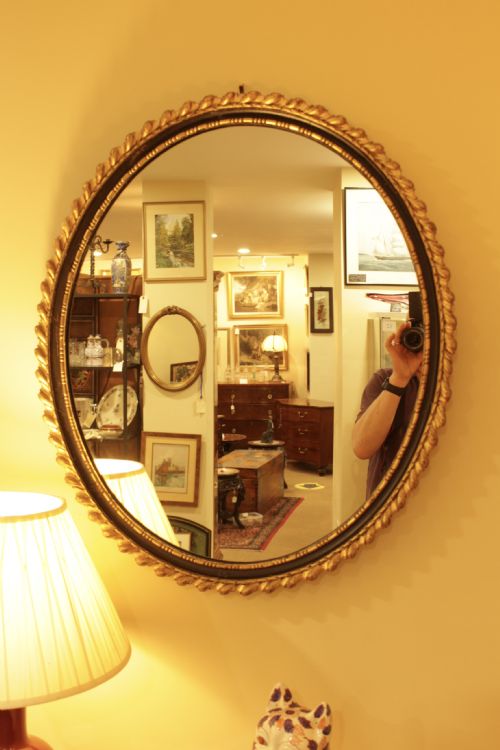 A 19th C. Oval Gilt & Ebonised Mirror