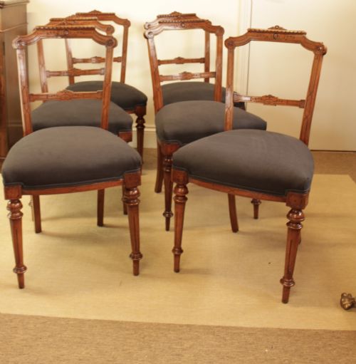 A Set of Six Walnut Chairs