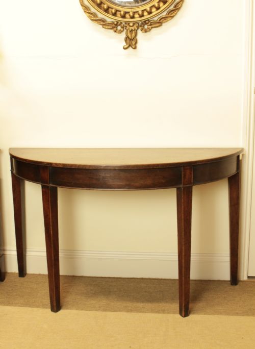 A Georgian Mahogany Demi Lune Table