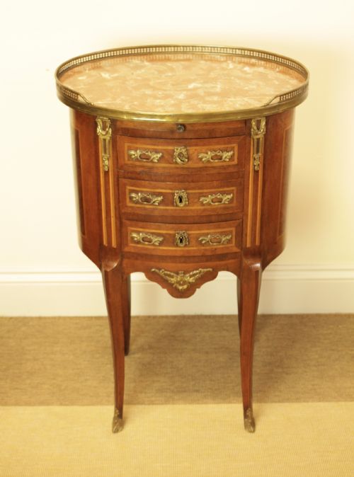 A French Walnut Oval Marble Top Three Drawer Side Table