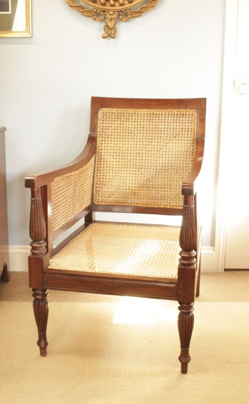 An Anglo-indian Hardwood Frame Bergere Chair
