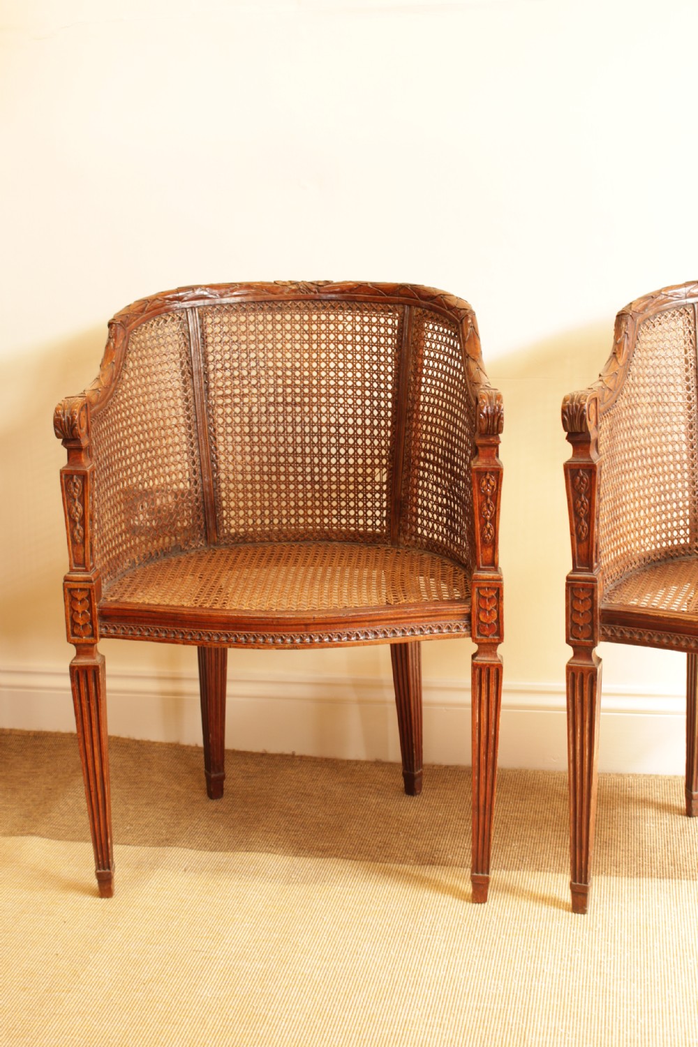 A Pair of Walnut Canned Arm Chairs View II