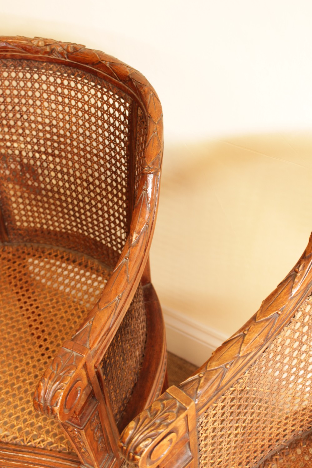 A Pair of Walnut Canned Arm Chairs View V