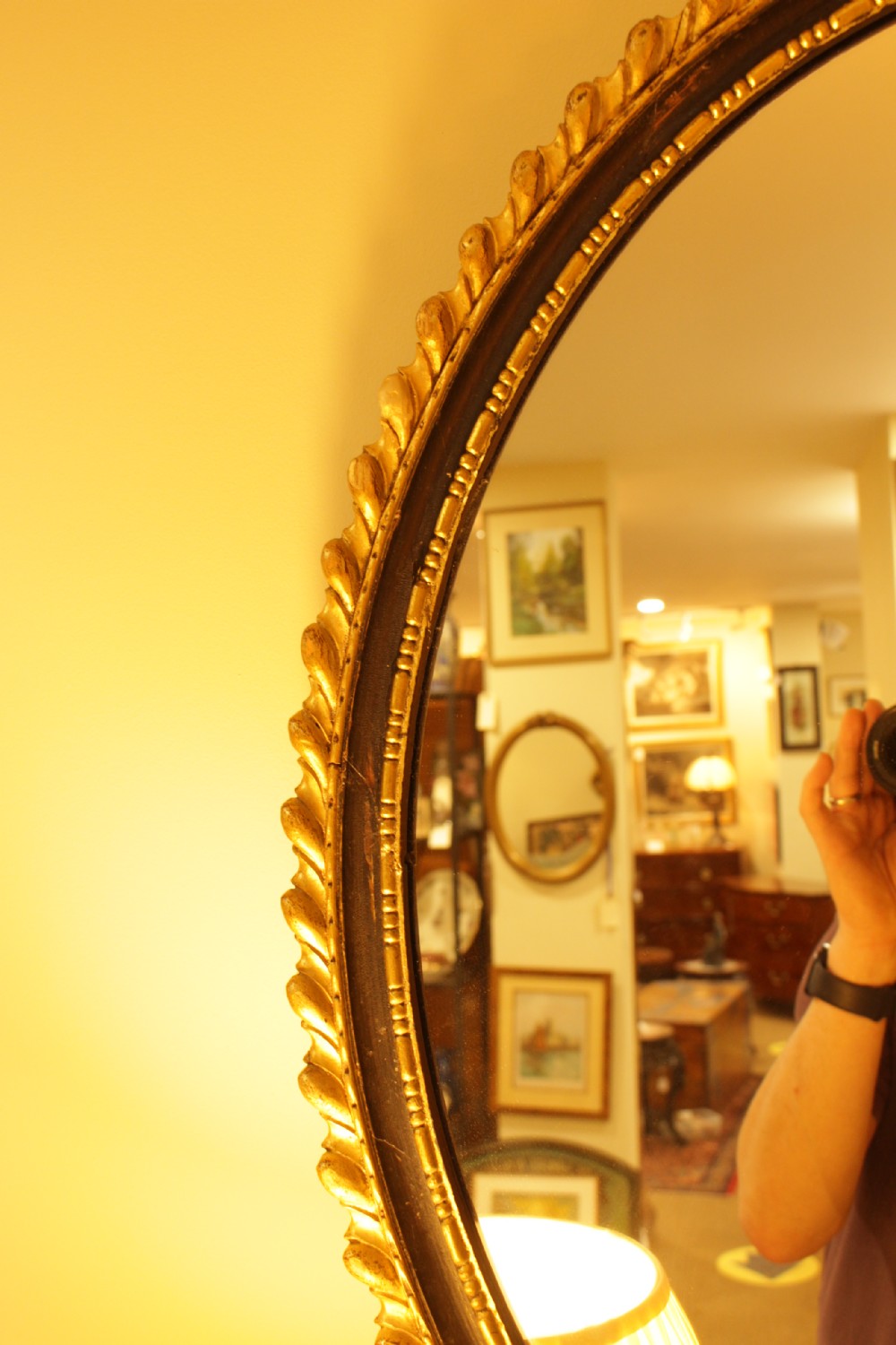A 19th C. Oval Gilt & Ebonised Mirror View III