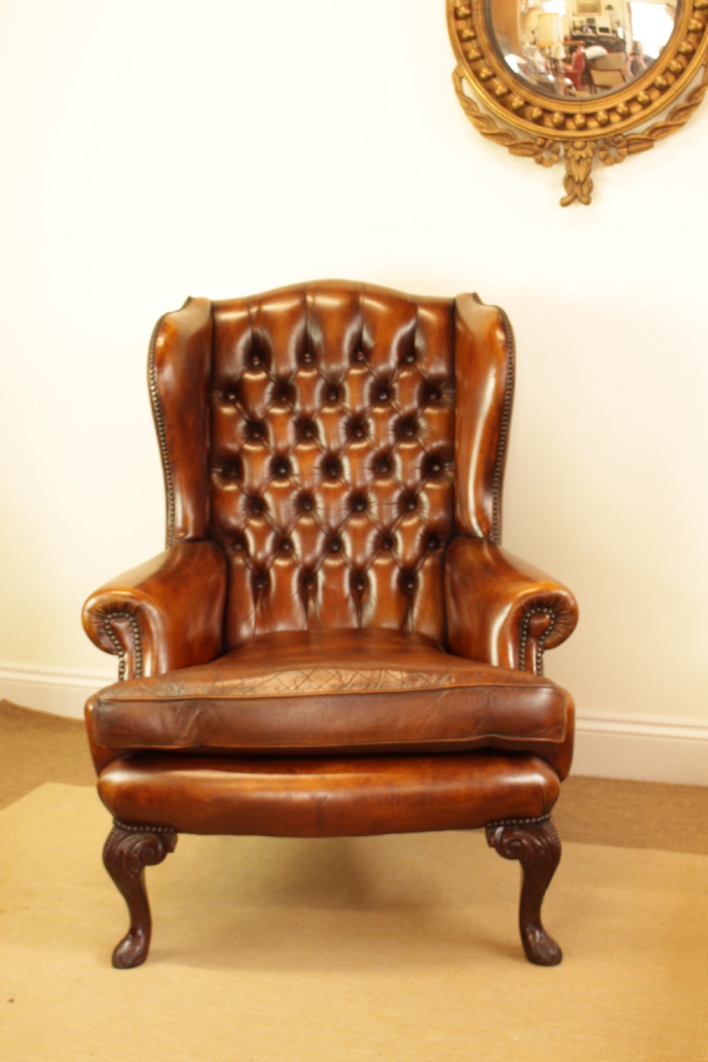 A Button Back Leather Wing Arm Chair 
