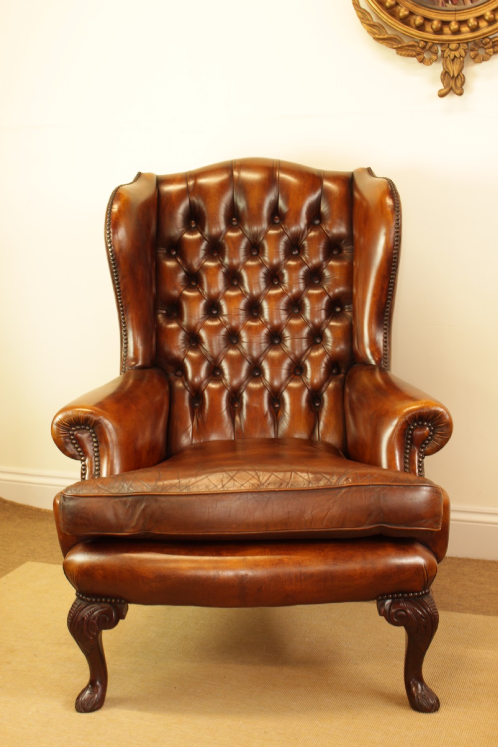 A Button Back Leather Wing Arm Chair  View II