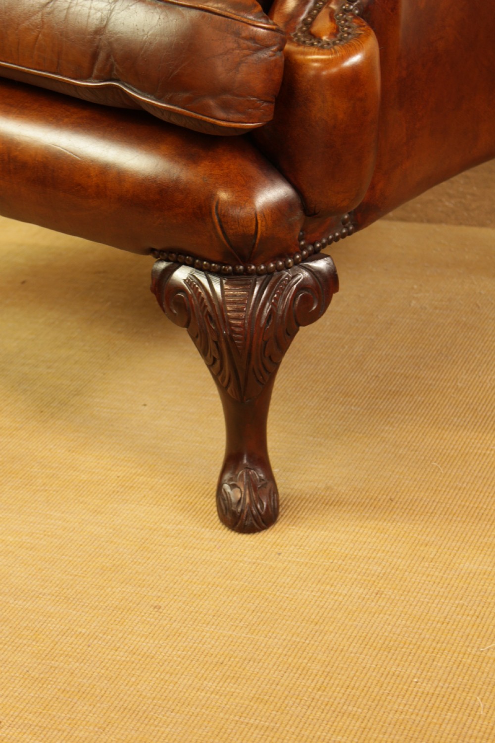A Button Back Leather Wing Arm Chair  View V