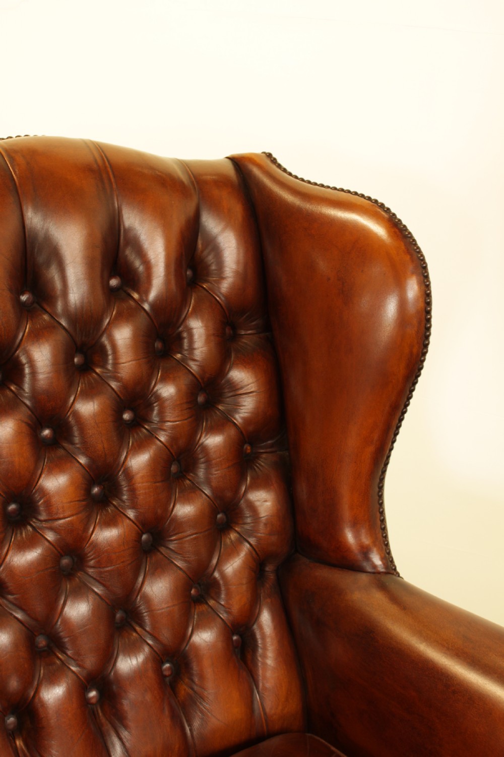 A Button Back Leather Wing Arm Chair  View IX