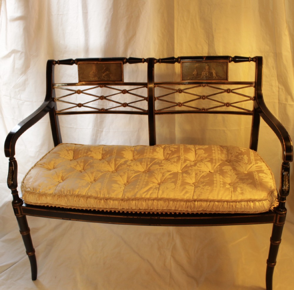 A Ebonised Two Seater Cane Sofa 