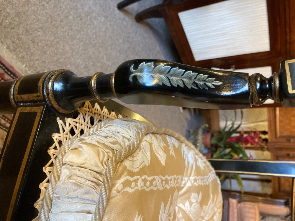 A Ebonised Two Seater Cane Sofa  View II