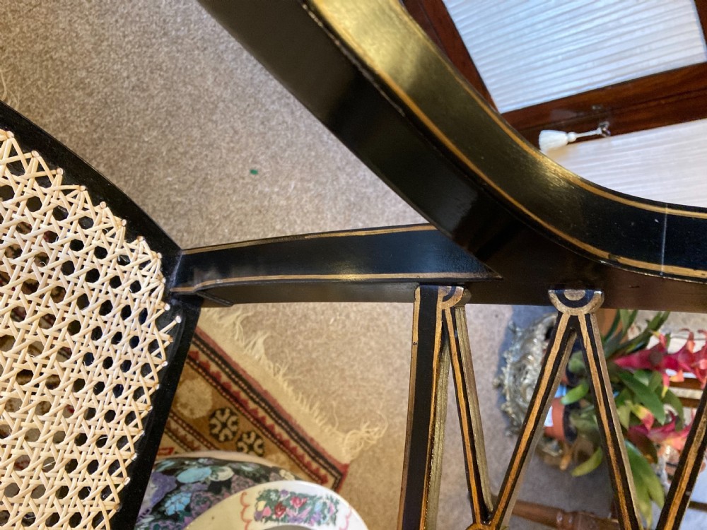 A Ebonised Two Seater Cane Sofa  View V