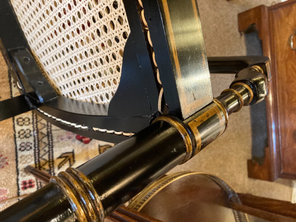 A Ebonised Two Seater Cane Sofa  View VII
