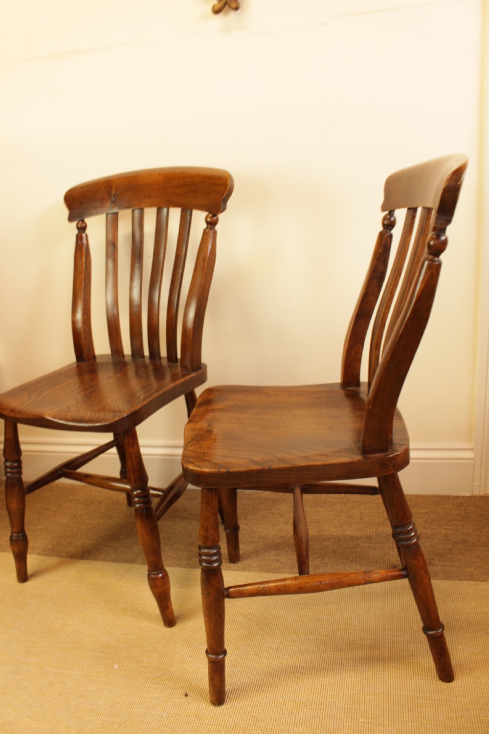Set of four dark-stained wooden kitchen chairs featuring shaped elm seats, turned legs, and backrest spindles with curved top crest rails. View II