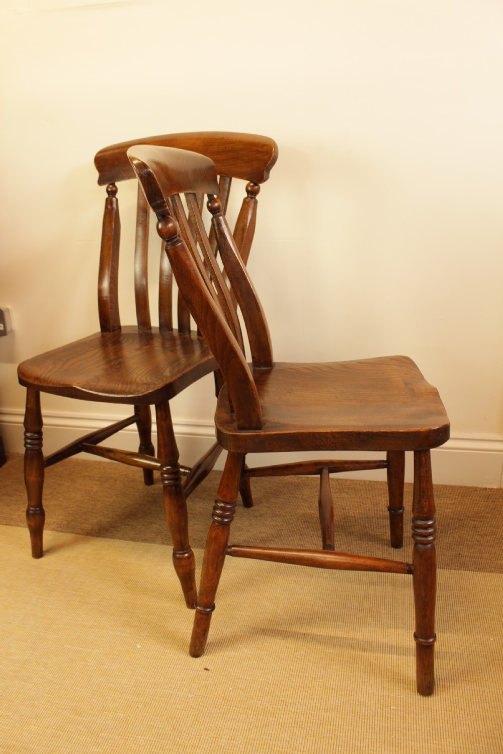 Set of four dark-stained wooden kitchen chairs featuring shaped elm seats, turned legs, and backrest spindles with curved top crest rails. View III