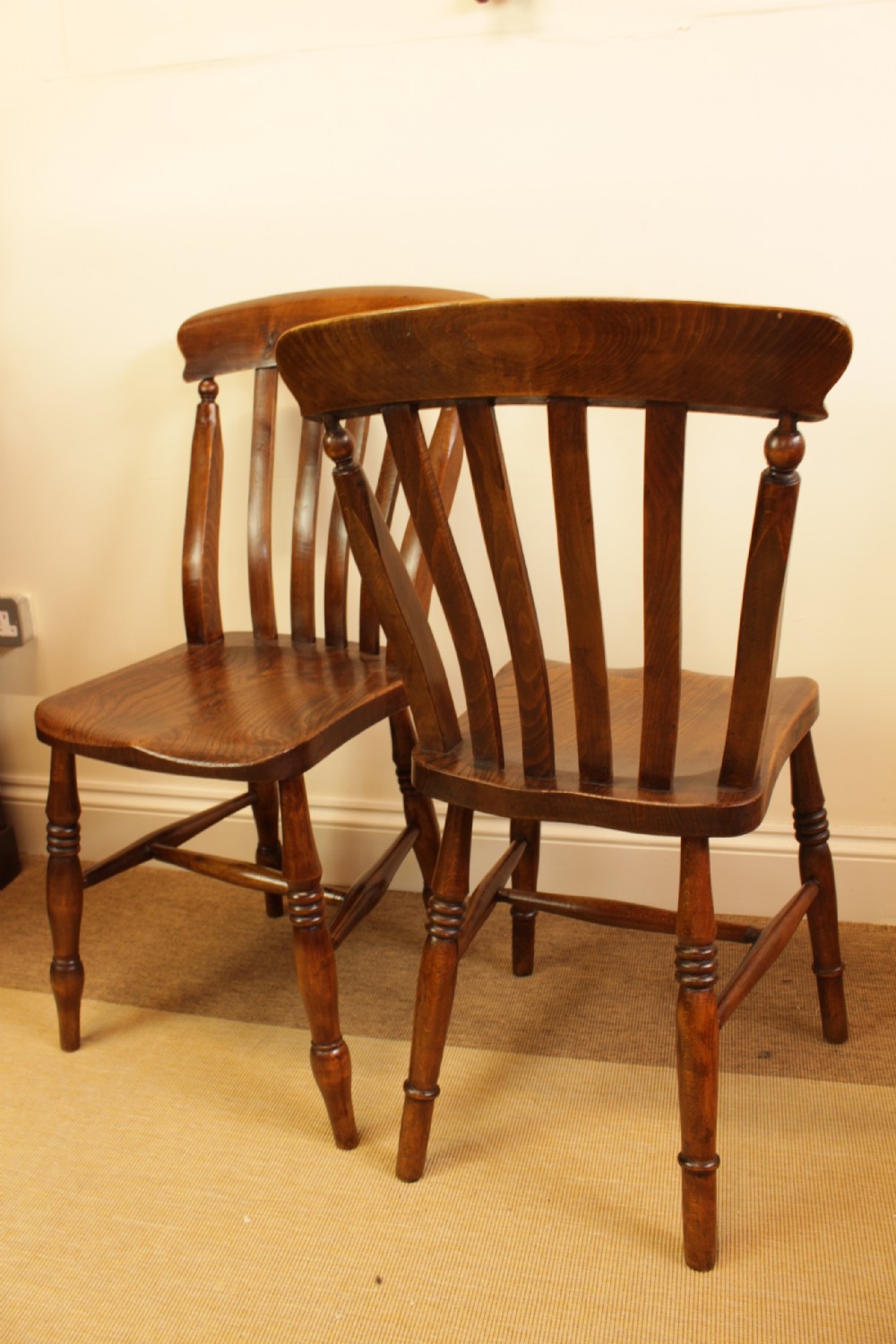 Set of four dark-stained wooden kitchen chairs featuring shaped elm seats, turned legs, and backrest spindles with curved top crest rails. View VI