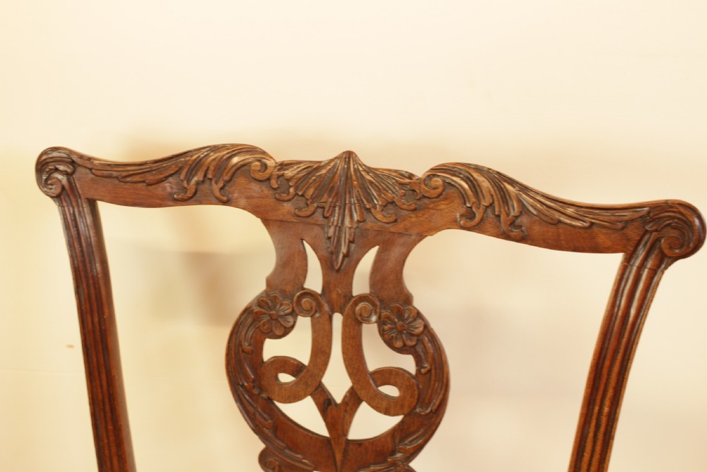 An 18th-century Chippendale-style carved mahogany side chair featuring a pierced back splat and a cream needlepoint tapestry seat. View IV