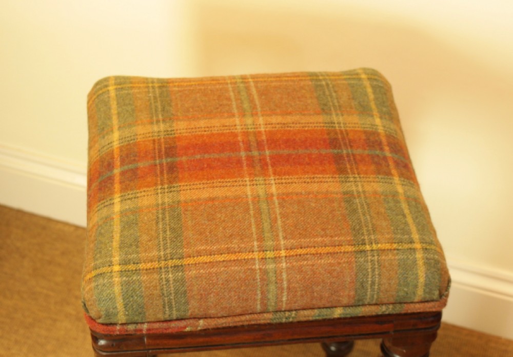 A 19th-century mahogany stool featuring turned reeded legs and a square tartan wool upholstered seat. View V