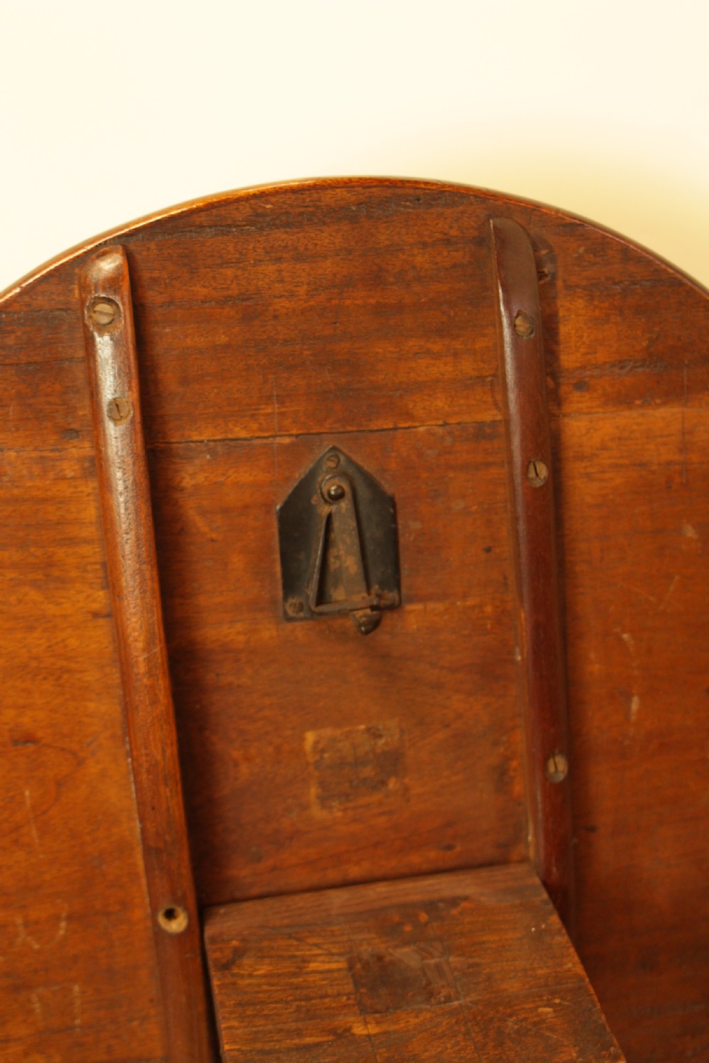 A George III period circular mahogany tilt-top table with a turned central column and tripod cabriole legs. View IV
