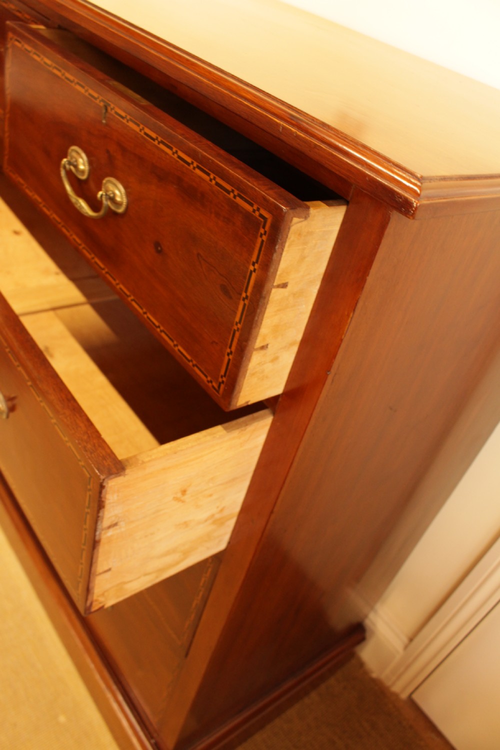 A Walnut Chest Of Drawers  View III