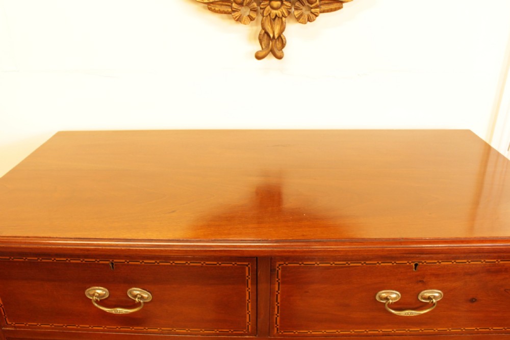 A Walnut Chest Of Drawers  View V