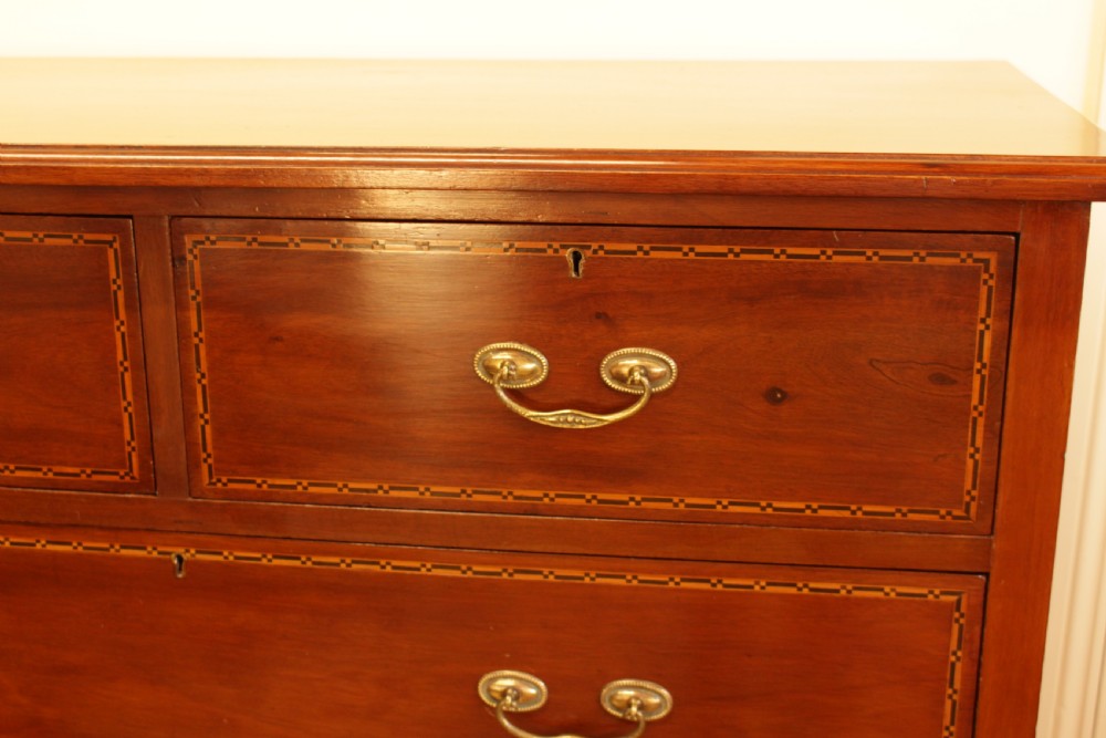 A Walnut Chest Of Drawers  View VI
