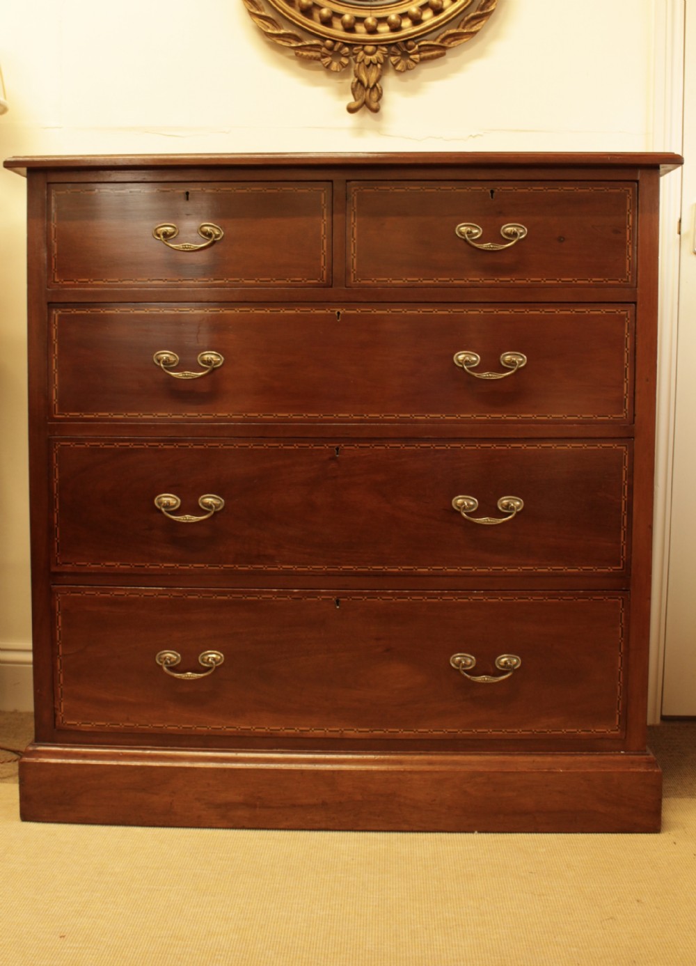 A Walnut Chest Of Drawers 
