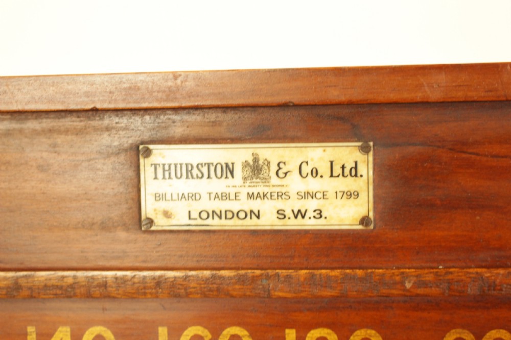 A rectangular mahogany billiards scoring board featuring two horizontal tracks with sliding wooden markers, yellow painted numbers, and a maker plaque at the top centre. View IV
