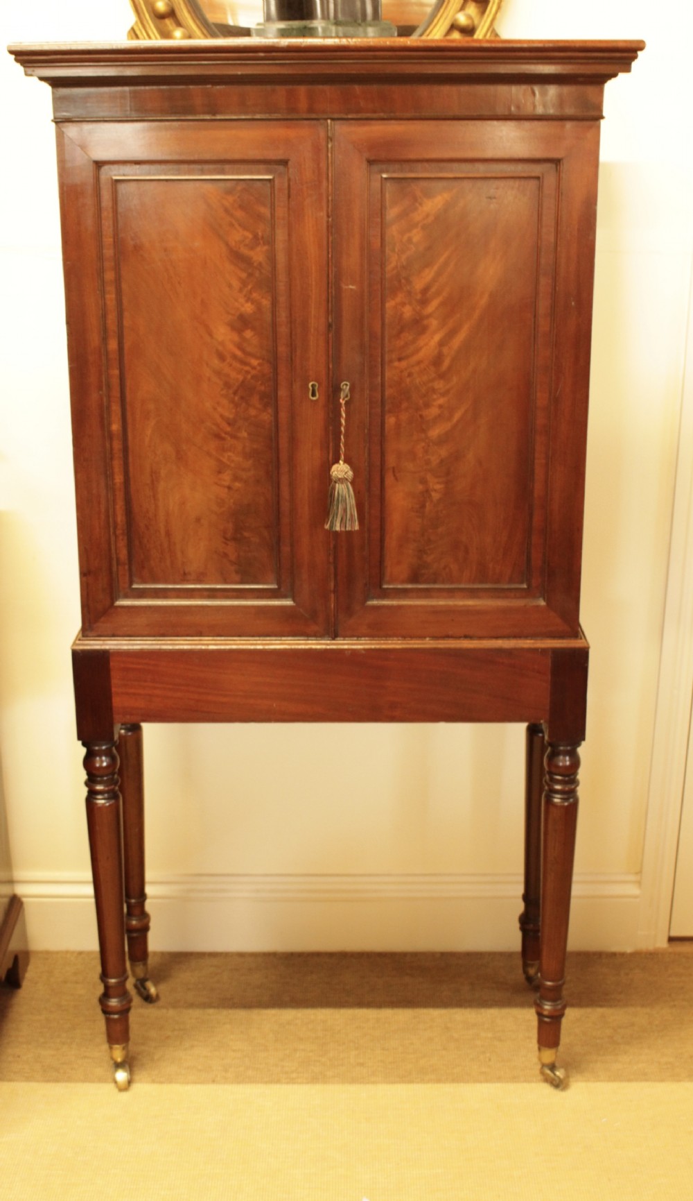 A Georgian Mahogany Cabinet On Stand 