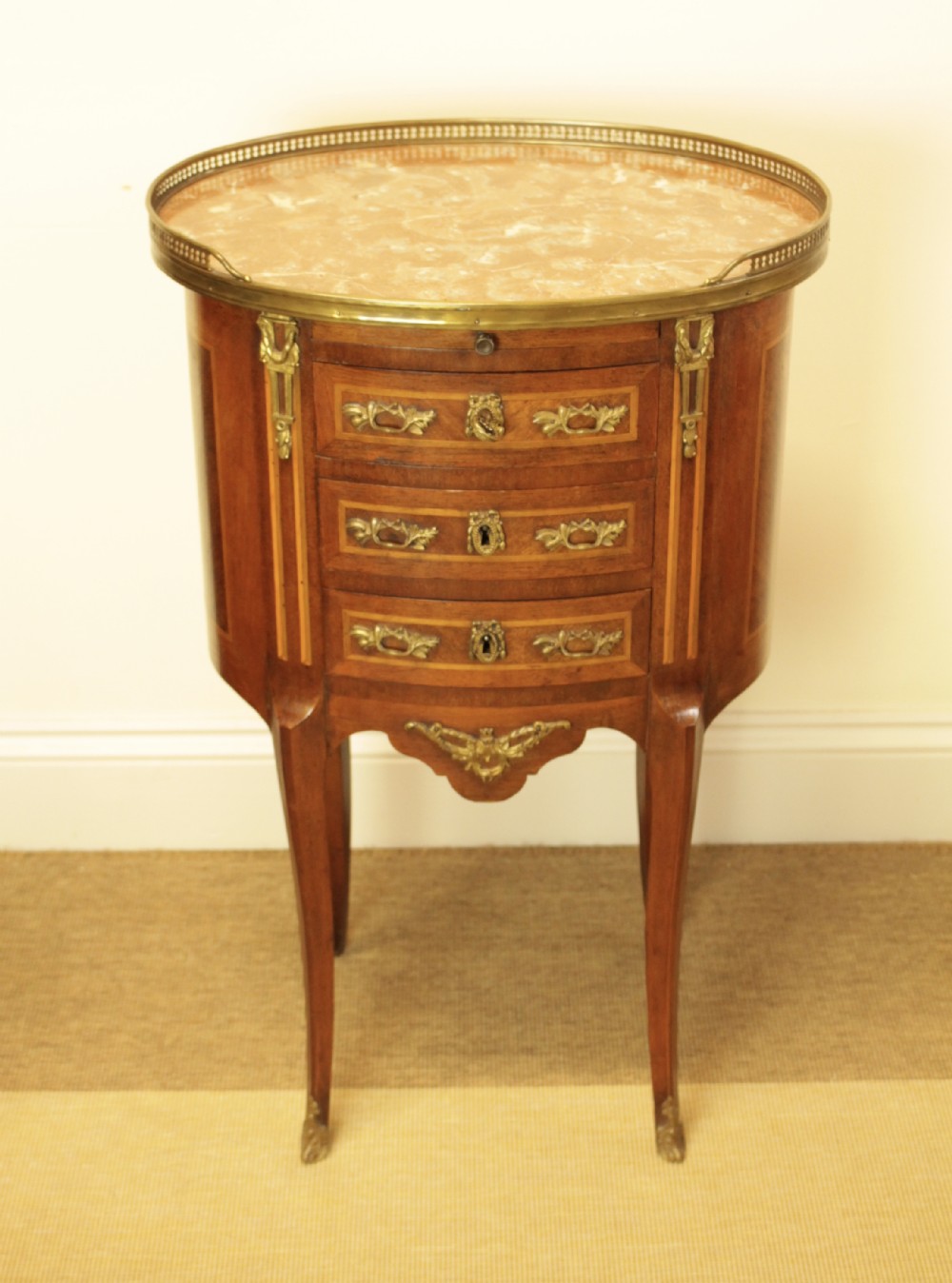 A French Walnut Oval Marble Top Three Drawer Side Table  