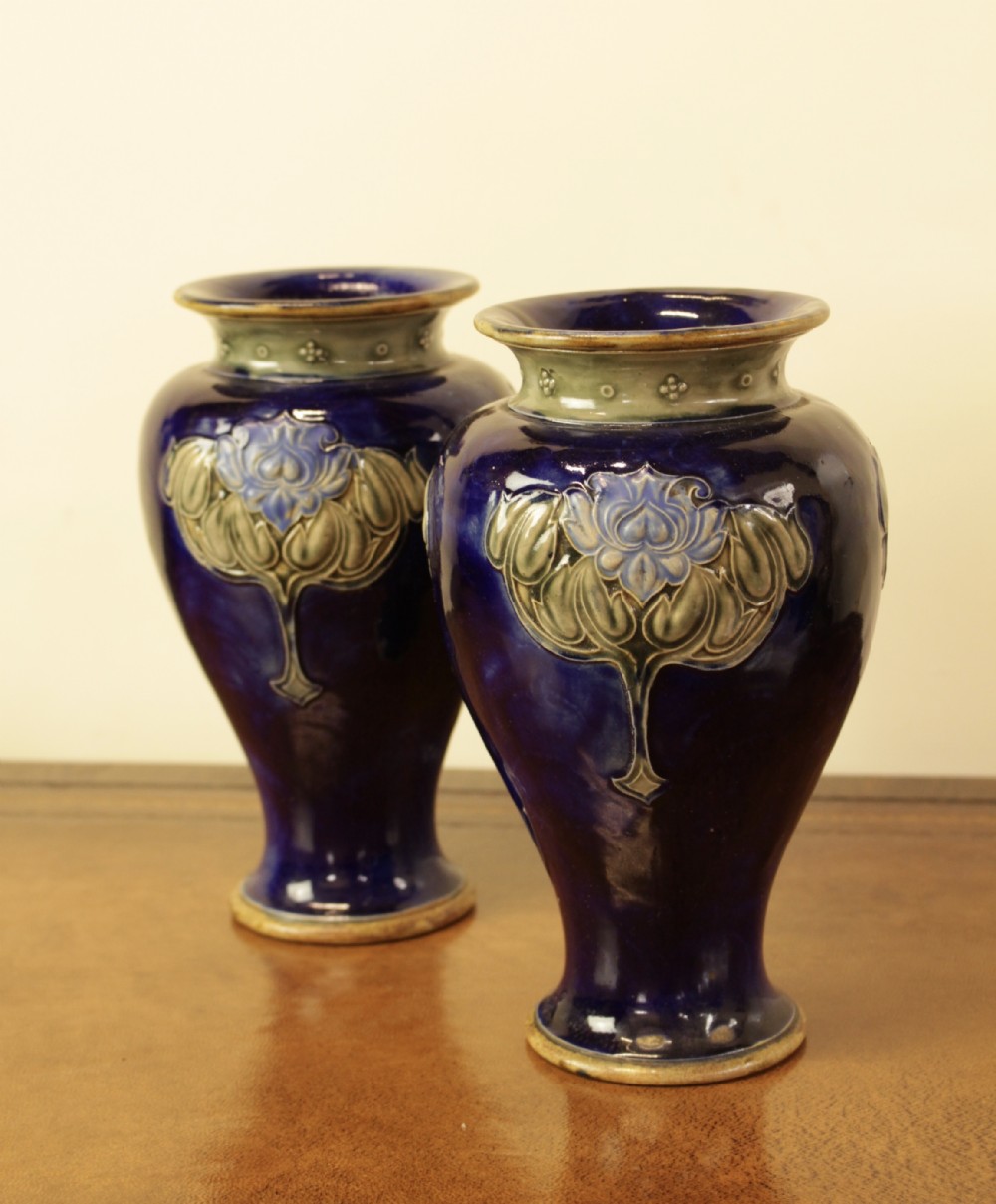 A Pair Of Blue Royal Doulton Vases 
