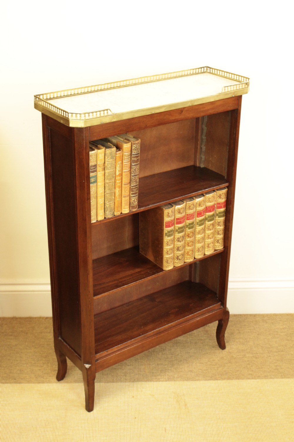 A French Marble Top Mahogany Bookcase