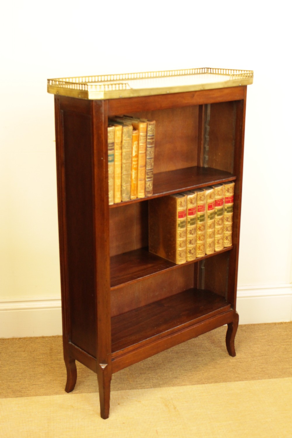 A French Marble Top Mahogany Bookcase View II