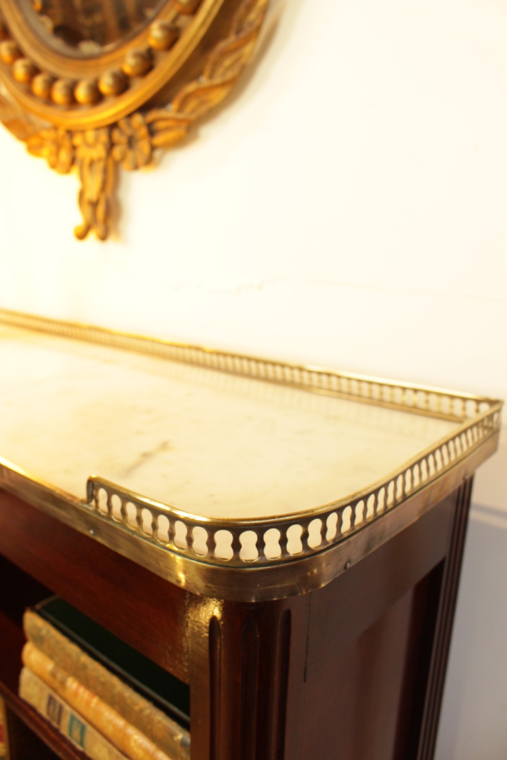 A French Mahogany Carrara Marble Top Bookcase   View II