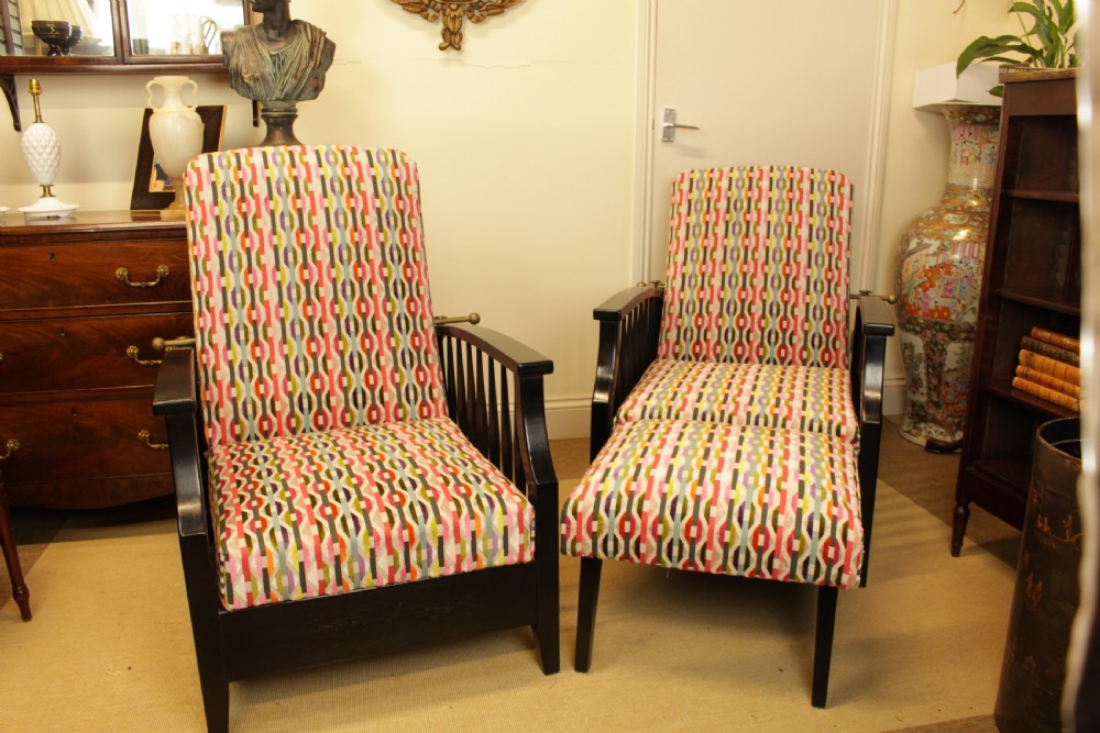 A Pair of 1920's Ebony Adjustable Reclining Chairs 