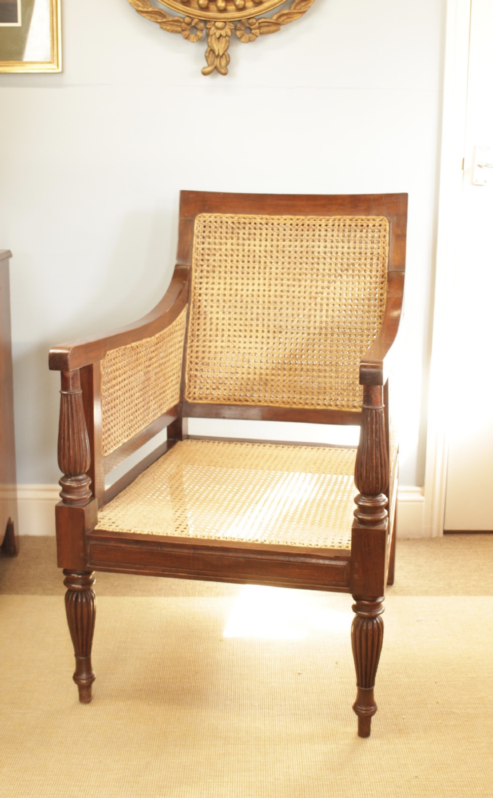 An Anglo-Indian Hardwood Frame Bergere Chair 