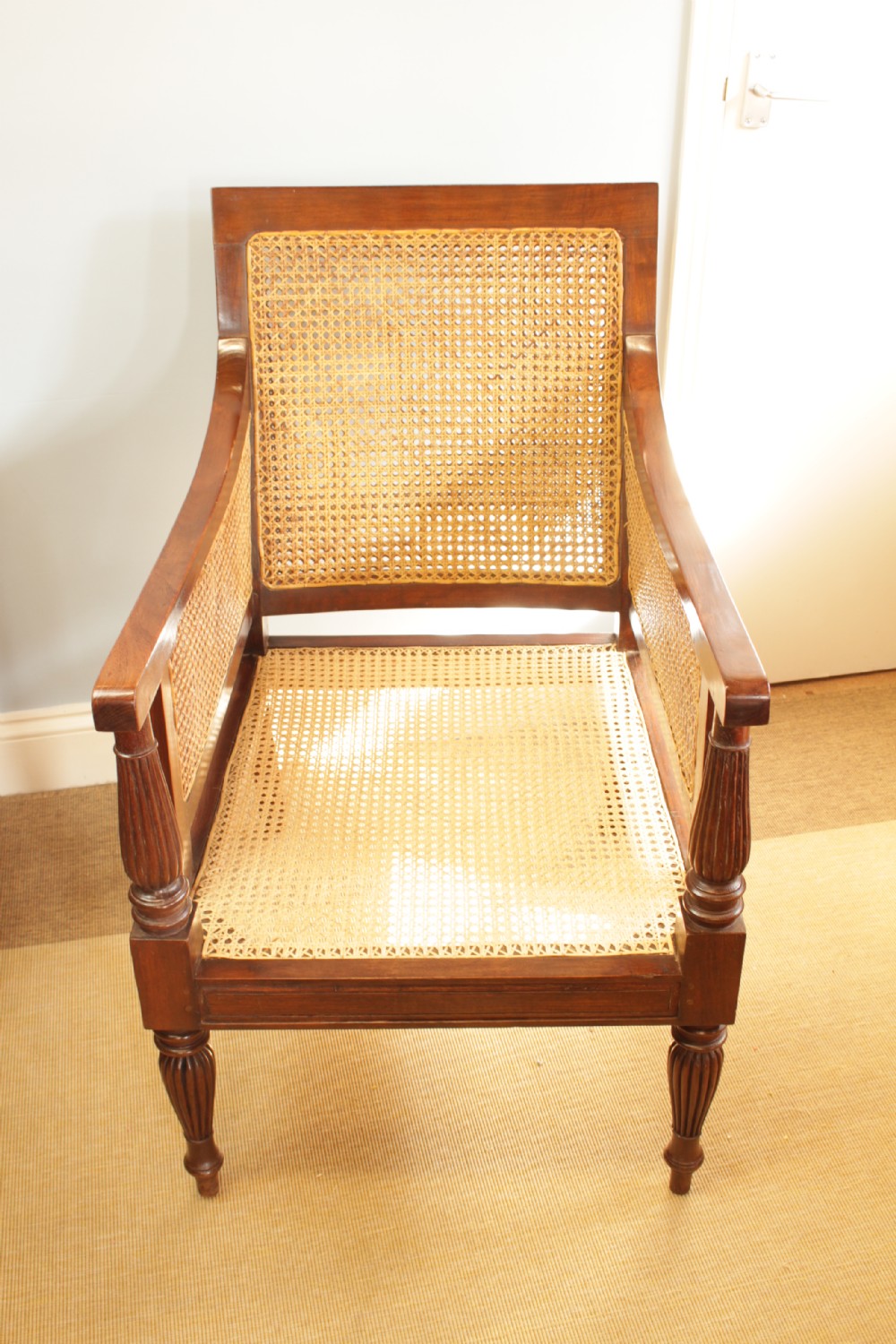An Anglo-Indian Hardwood Frame Bergere Chair  View III