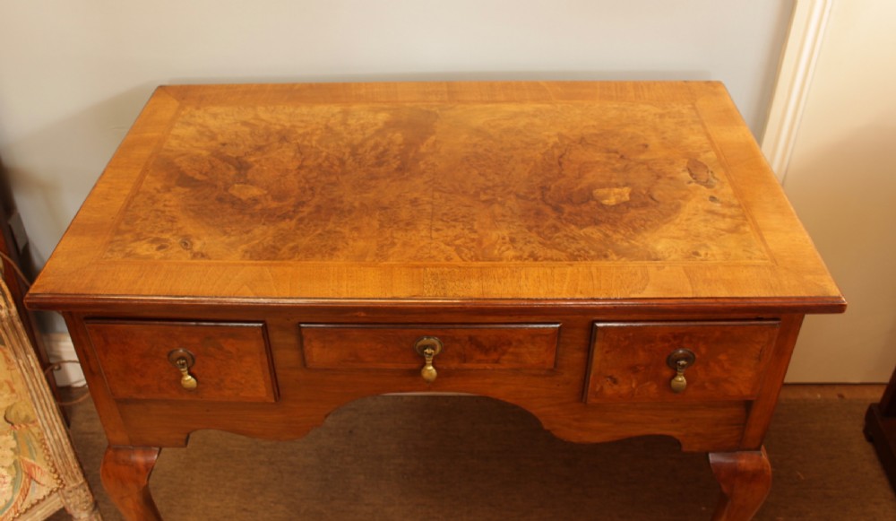 A George III Walnut Lowboy View II