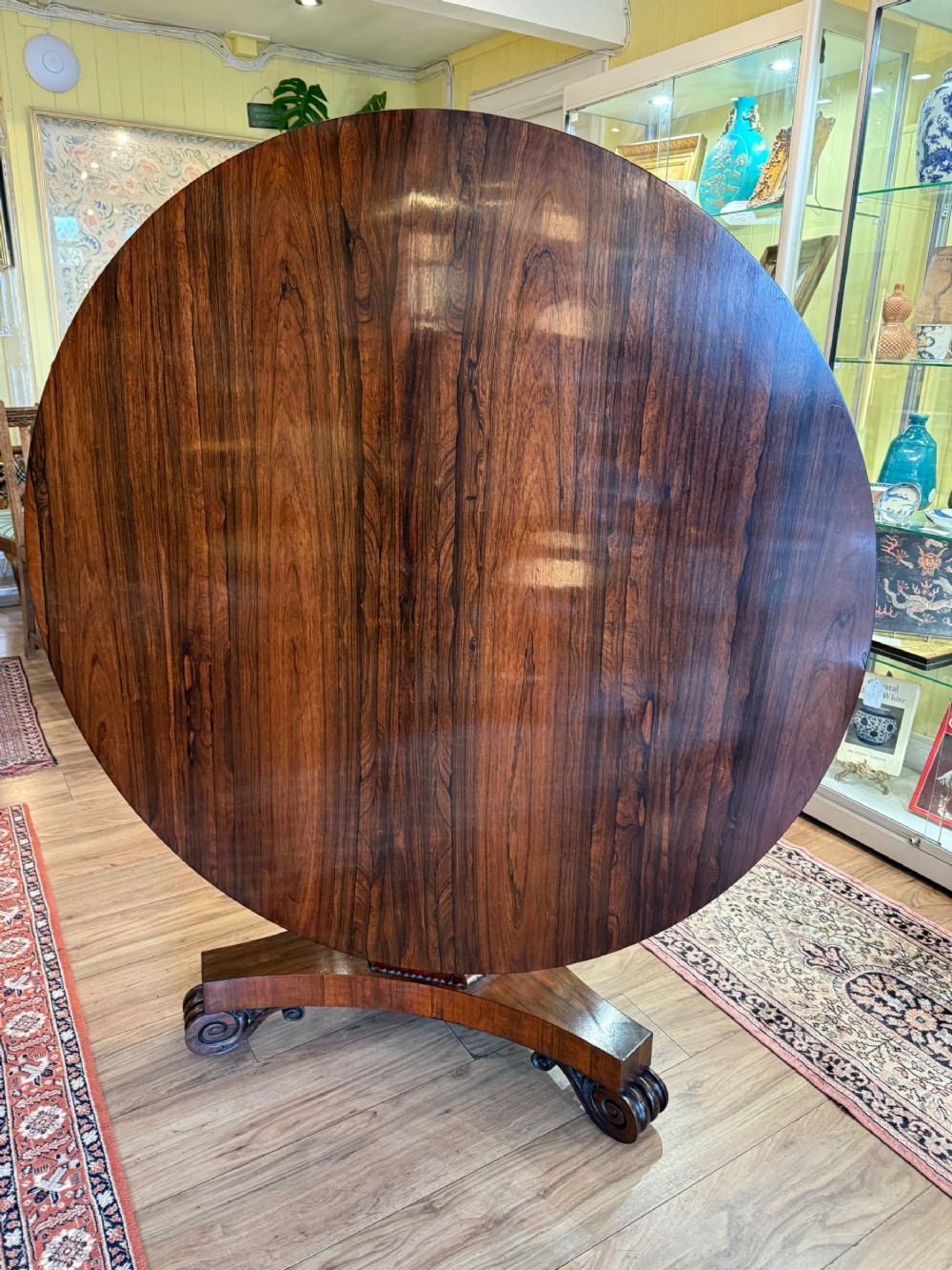 A Rosewood Tilt Top Dining Table