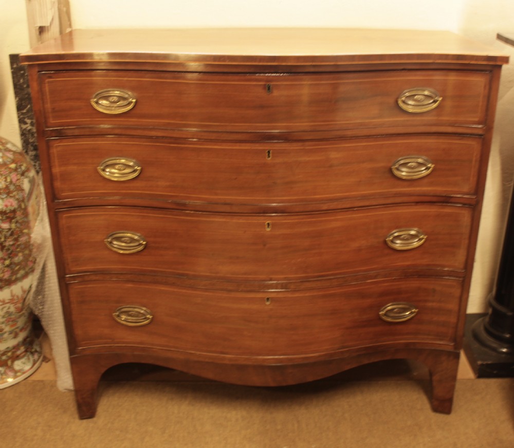 A Georgian Mahogany Serpentine Chest Of Drawers  