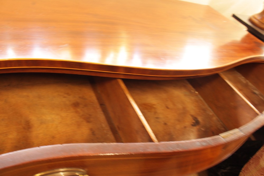 A Georgian Mahogany Serpentine Chest Of Drawers   View III