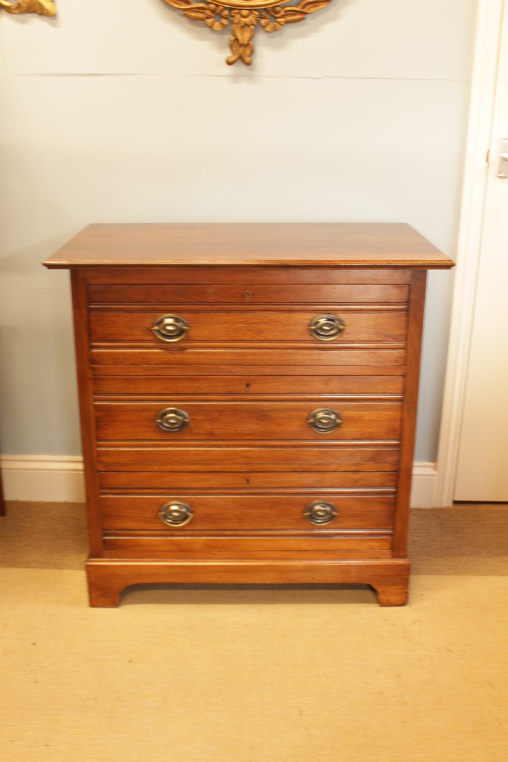 A Edwardian Walnut Chest Of Drawers 